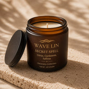 Wave Lin Secret Spell Candle in amber glass jar